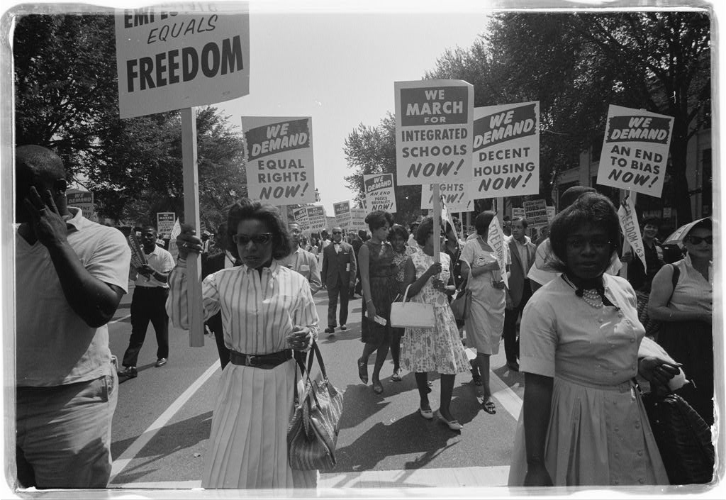 Marchers with signs at the March on Washington, 1963.