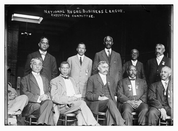 Photo shows African American leaders, including Booker T. Washington seated second from left.