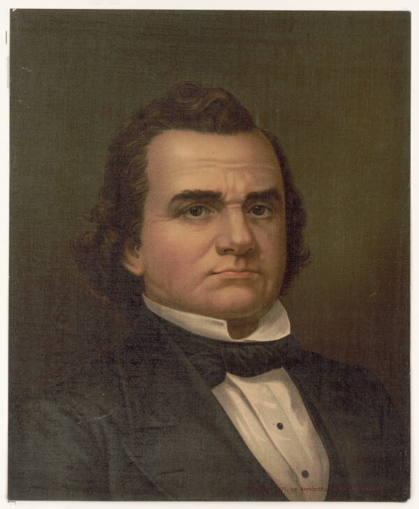 A front-facing bust portrait of a white man with full brown hair wearing a stiff tall white collar with a black tie and black suit jacket.