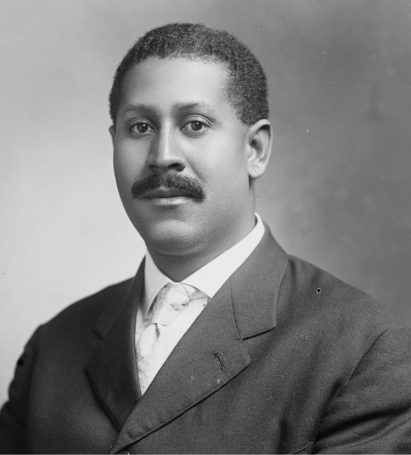 Portrait of Jesse Max Barber, editor-in-chief of The Voice of the Negro, wearing a suit and tie