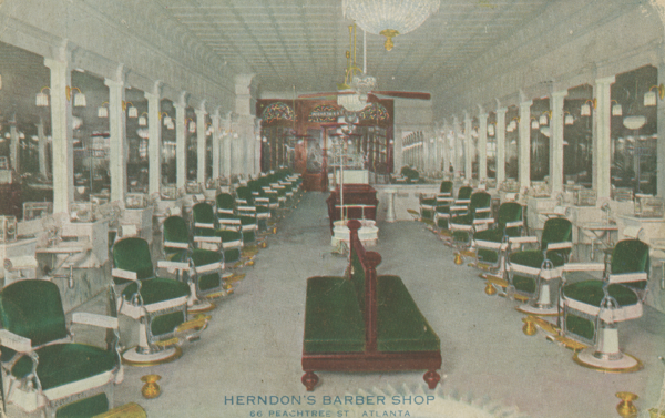 Interior of Alonzo Herndon’s upscale barbershop in Atlanta, showing long rows of ornate barber chairs, mirrors, and chandeliers in a large, brightly lit space