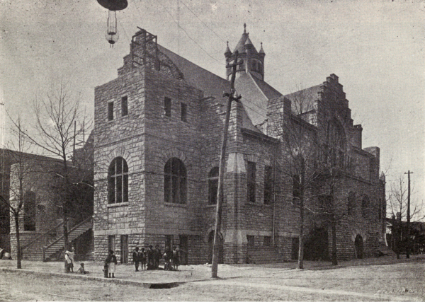 Historic photograph of Big Bethel AME Church, a large stone church building on a street corner with people gathered outside in Atlanta