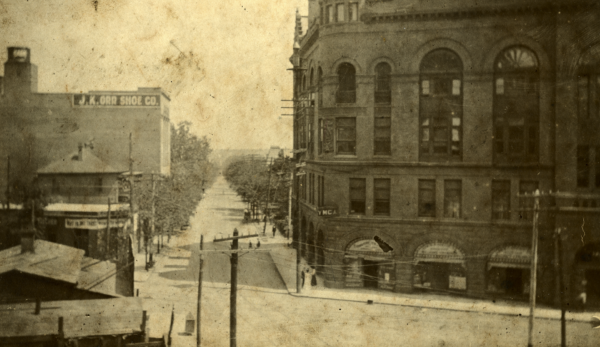 View of Auburn Avenue in Atlanta looking down Pryor Street, showing early 20th-century buildings, storefronts, and a broad street extending into the distance
