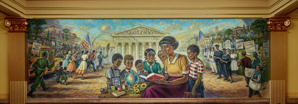 A painted mural shows a teacher reading a book about Brown v. Board of Education to six students. All around them the background portrays various scenes from the fight for school equality.